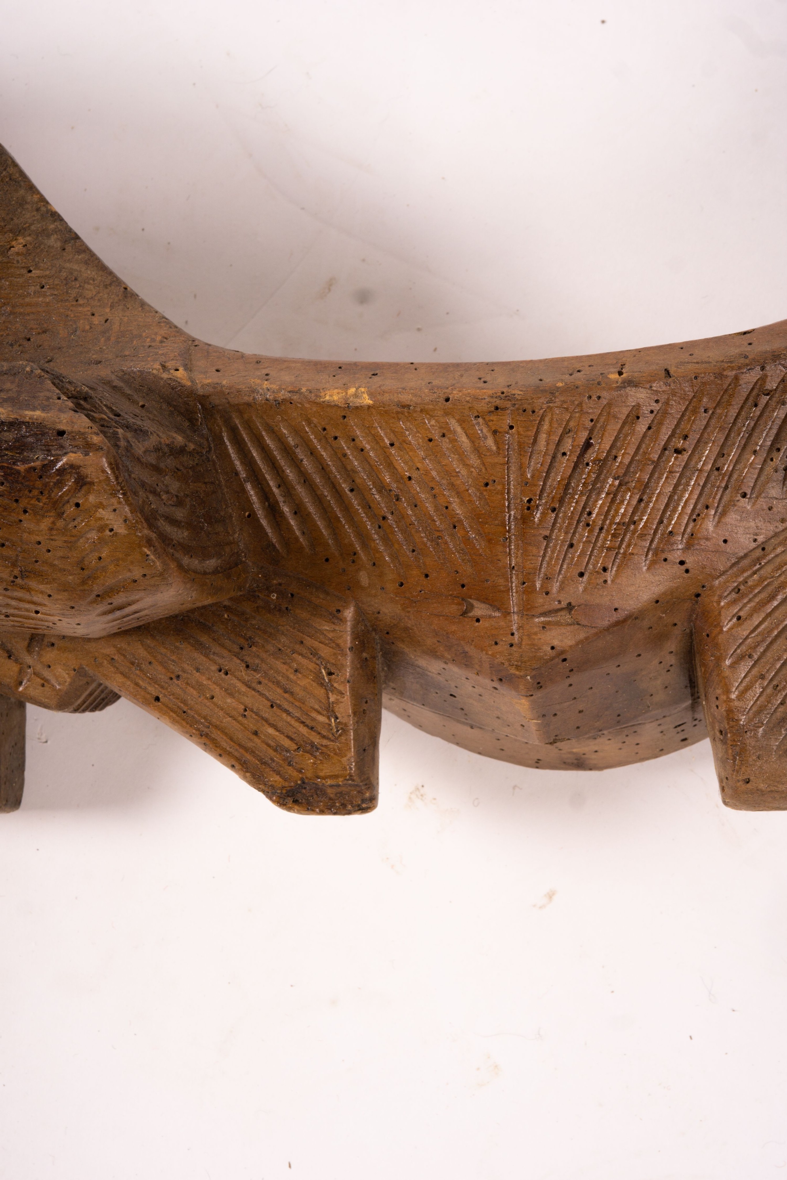 A 19th century Spanish carved fruitwood ox yoke, length 108cm